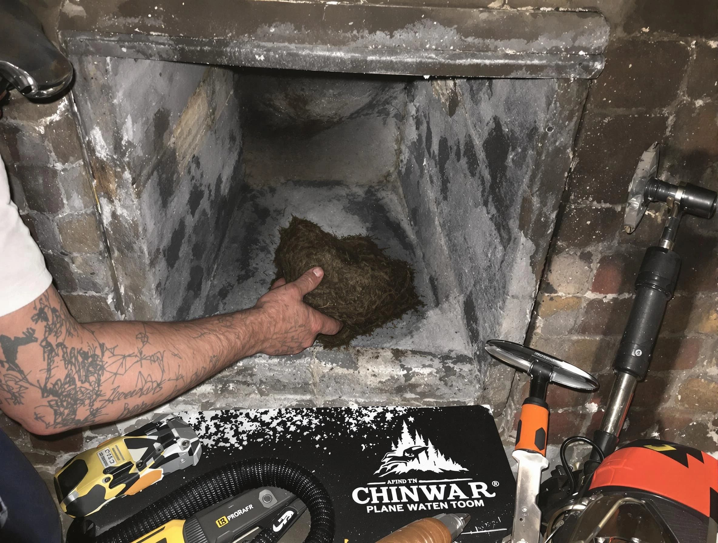 Decatur Chimney Sweep safely removing debris and screening chimney in Decatur, GA